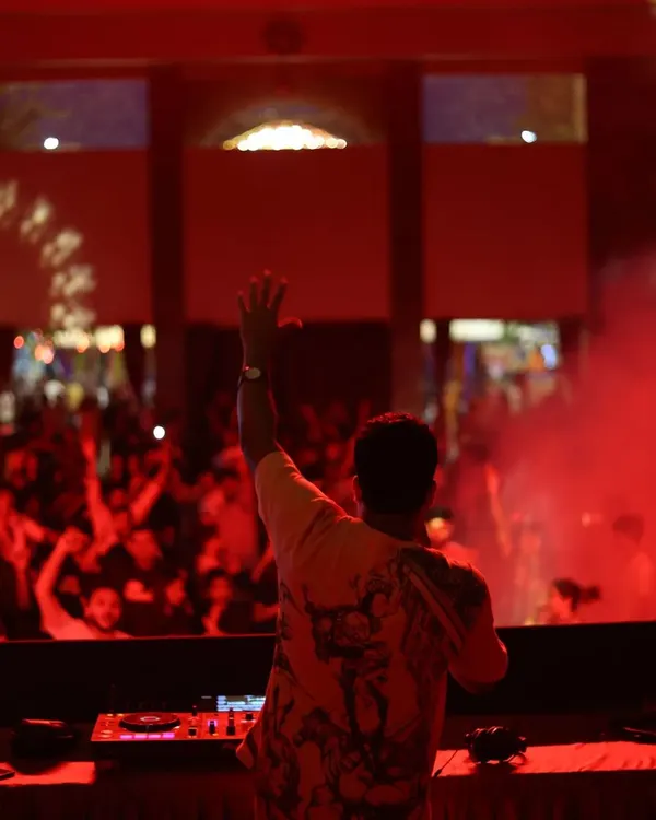 Greeting the massive crowd from the stage during a mini-concert at Wonderla. The energy exchange with thousands of people is what makes festival gigs so incredible.