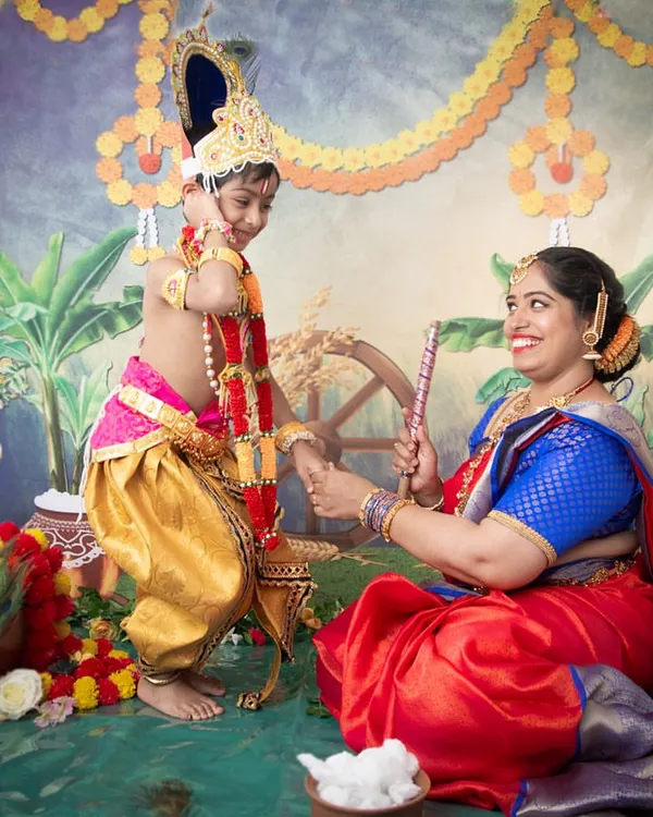 A beautiful moment between mother and son during our Yashoda Krishna themed photoshoot. The vibrant colours and traditional props create an authentic and heartfelt portrait celebrating Janmashtami.