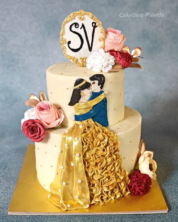 This two-tier engagement cake features a hand-painted couple figurine with a beautiful ruffled gold dress. It's a romantic centerpiece, perfect for celebrating your love story.