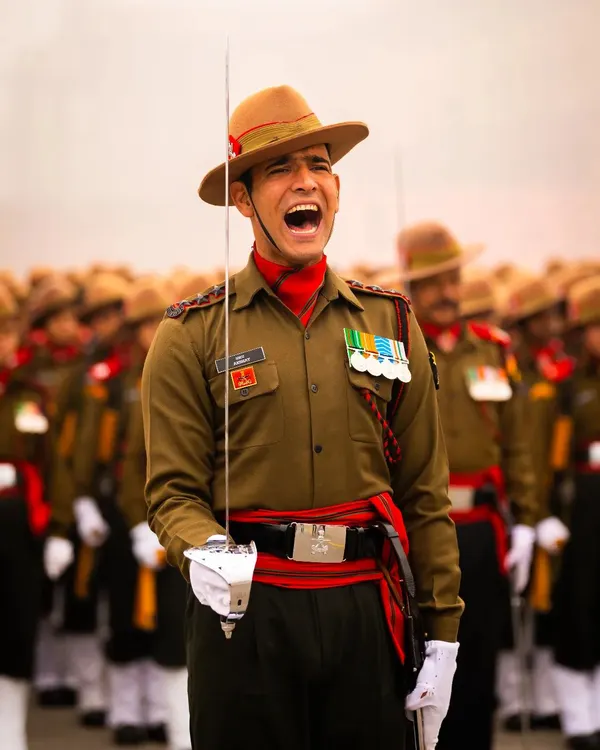 The intensity and discipline of our armed forces are truly inspiring. This close-up of a soldier during a parade rehearsal captures the powerful command and pride in his expression, a testament to his dedication.