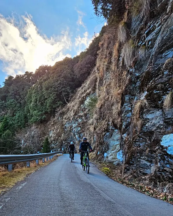 Two riders enjoying the quiet, scenic roads of Uttarakhand. Our Kumaon tours are designed to show you the hidden beauty of this state, away from the crowds.