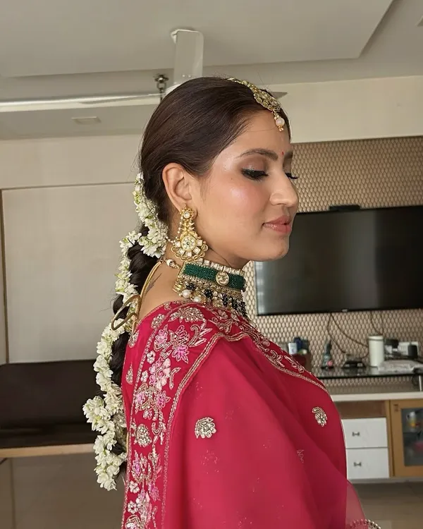 This is my signature timeless bridal look. I focused on creating flawless, dewy skin with classic kohl-rimmed eyes and paired it with a traditional floral braid, ensuring the bride felt radiant and confident on her big day.