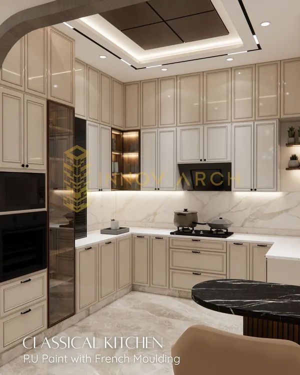 This is a classical kitchen I designed for a villa in Akansha Enclave. It features beautiful PU-painted cabinets with French moulding, built-in appliances, and a stunning marble backsplash, blending timeless style with modern convenience.