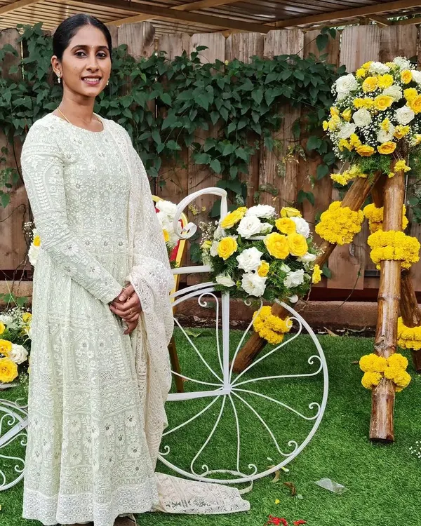 A client looking serene in a custom white Chikankari gown. I designed this piece using delicate georgette fabric, focusing on the intricate all-over embroidery to create an outfit of timeless elegance.