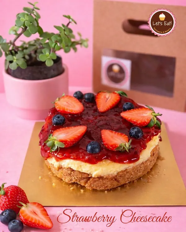 My Strawberry Cheesecake is a seasonal highlight. It features a creamy, rich cheesecake base on a buttery biscuit crust, topped with a generous layer of my homemade fresh strawberry compote and garnished with fresh berries.