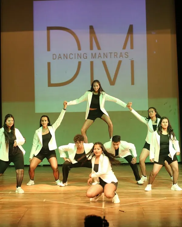 The perfect pyramid pose from our 'City of Stars 2025' showcase. This shot captures the teamwork, strength, and confidence our students build together.