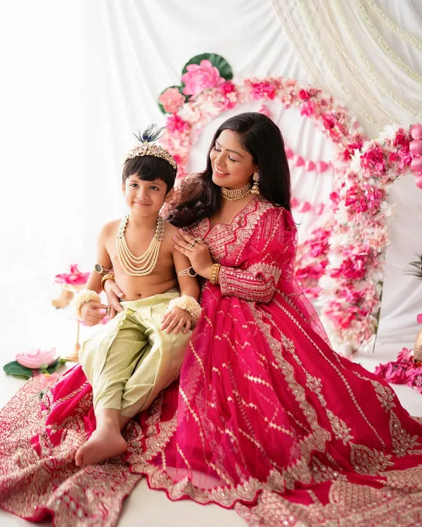 A beautiful portrait of a mother with her little Krishna. These mother-son moments during a festive photoshoot are truly special.