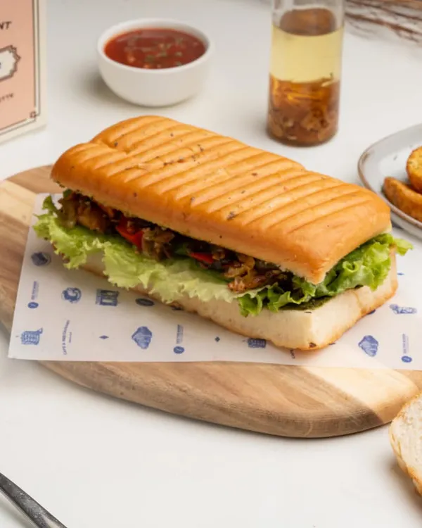 My Pesto Grilled Vegetable Focaccia sandwich. I pack freshly grilled vegetables and flavorful pesto into my soft, house-made focaccia bread.