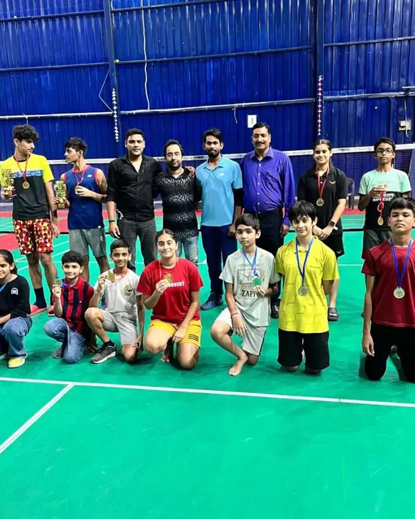 A proud moment with my group of tournament winners. Each medal represents countless hours of practice and dedication on the court.
