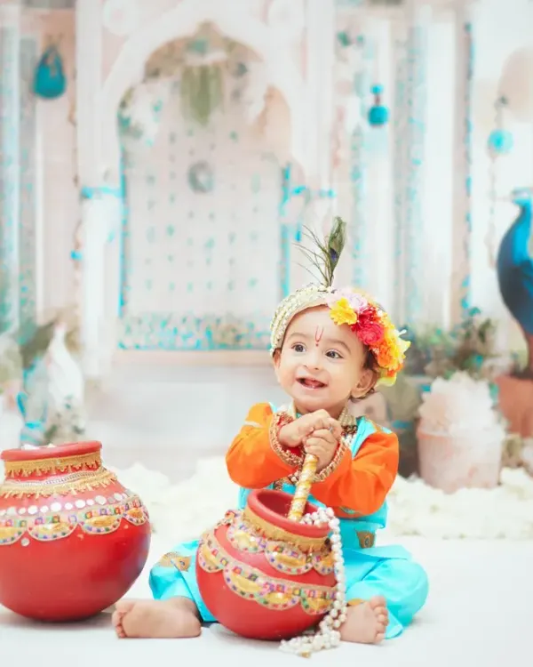 Our 'Little Krishna' Janmashtami setup is one of our most popular. We provide the full costume and beautiful backdrop for these divine portraits.