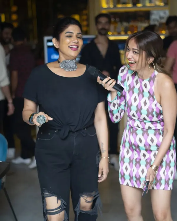 Two friends sharing a laugh and a song. My karaoke nights are the perfect backdrop for a fun night out, creating memories one track at a time.