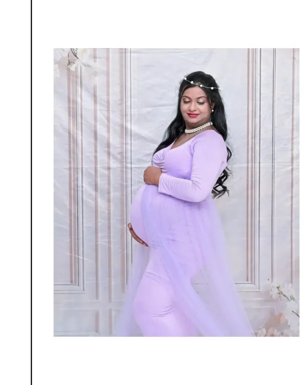A serene solo portrait in a beautiful lavender bodycon gown. The simple white backdrop and delicate pearl accessories create a look that is modern, elegant, and timeless.