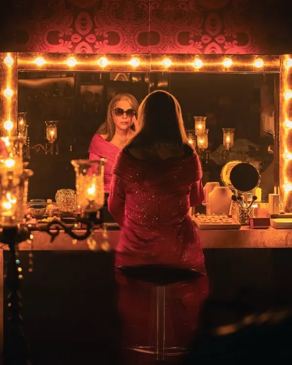 The moment before the magic. Here's the iconic Zeenat Aman in her vanity, wearing a custom-designed disco gown I created in just 36 hours for the Mia by Tanishq campaign. This project was a dream come true, blending classic glamour with modern commercial styling.