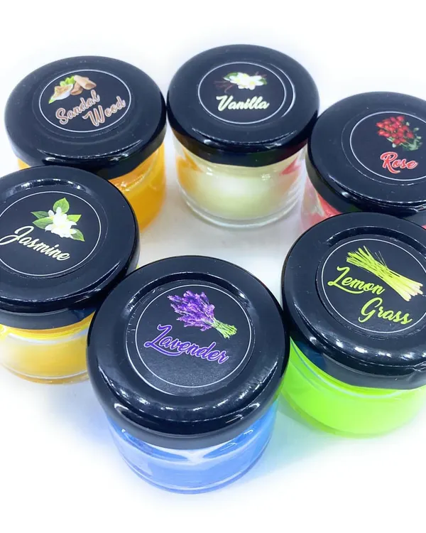A full display of my small scented jar candle collection. You can see the variety of scents available, including Sandalwood, Vanilla, Rose, Jasmine, Lemongrass, and Lavender.