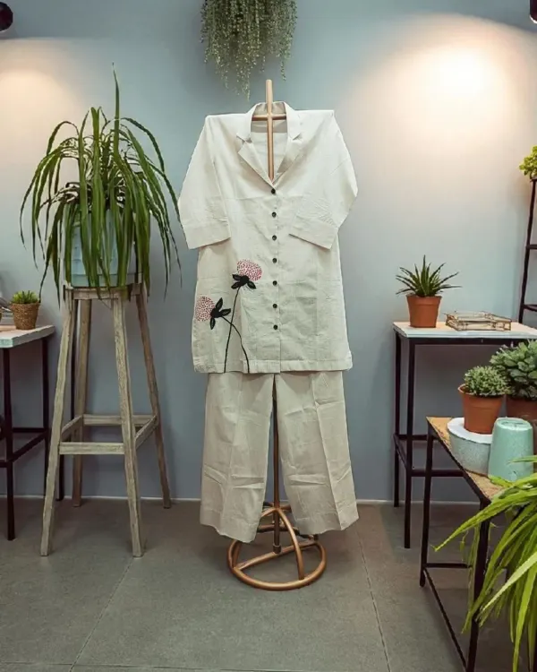 Elevate your summer style with this perfect co-ord set in cotton linen. It's breathable, chic, and effortlessly cool, with delicate floral embroidery for a touch of artistry.