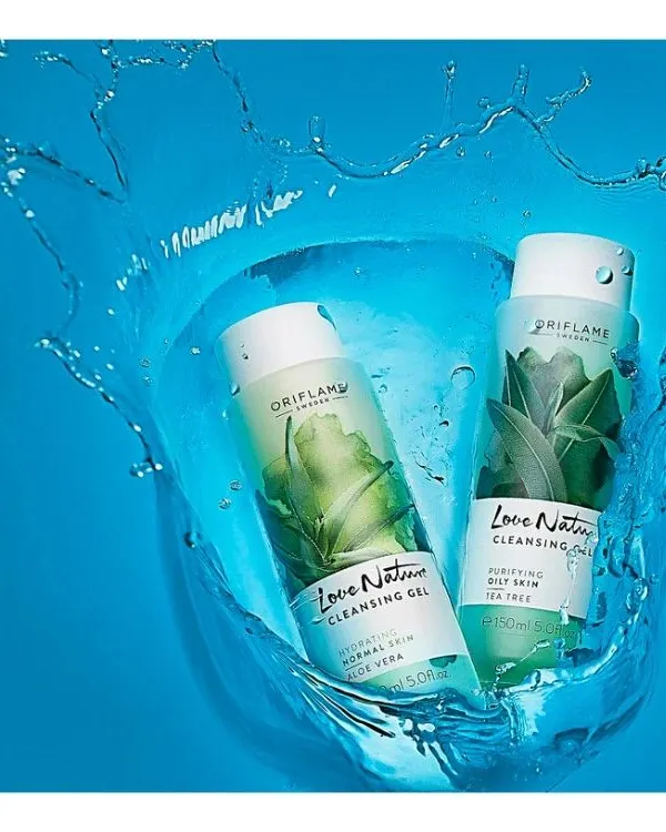 A dynamic splash shot capturing the freshness of Love Nature's Purifying Oily Skin and Hydrating Normal Skin cleansing gels. This type of cosmetic photography is perfect for highlighting a product's refreshing and high-quality formulation.
