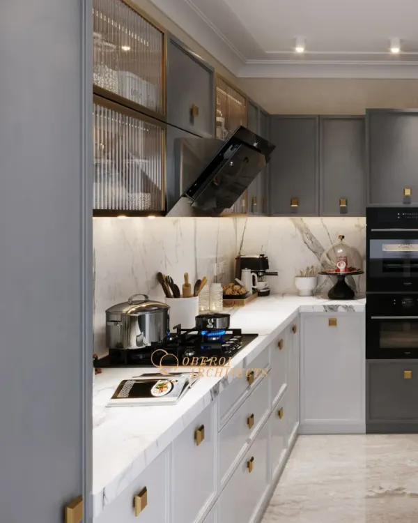 This modern kitchen combines sleek grey and white cabinetry with a stunning marble backsplash and countertop. The under-cabinet lighting provides excellent task lighting while adding to the ambiance.
