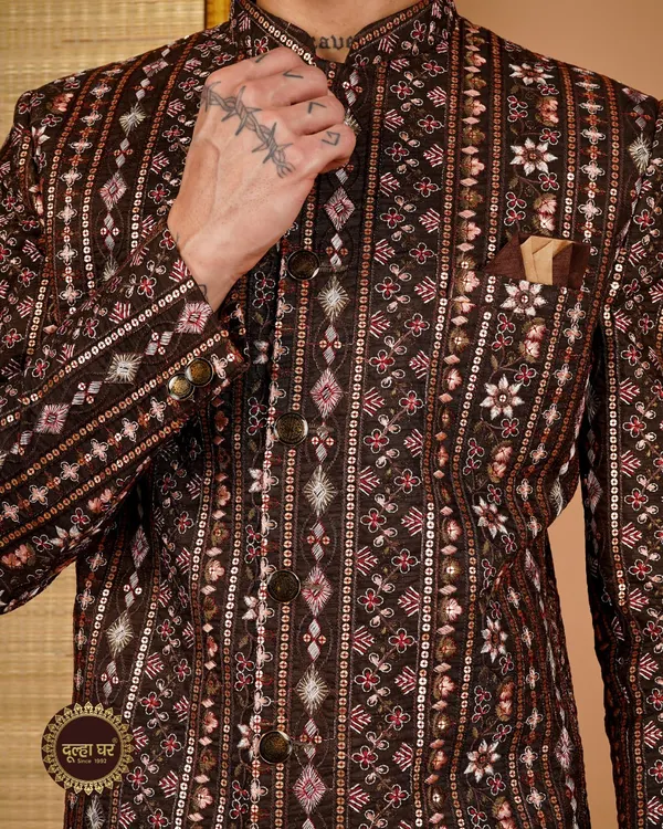A groom's royal look starts with the details. This close-up of a brown sherwani showcases the impeccable embroidery and sequin work that defines my craft.