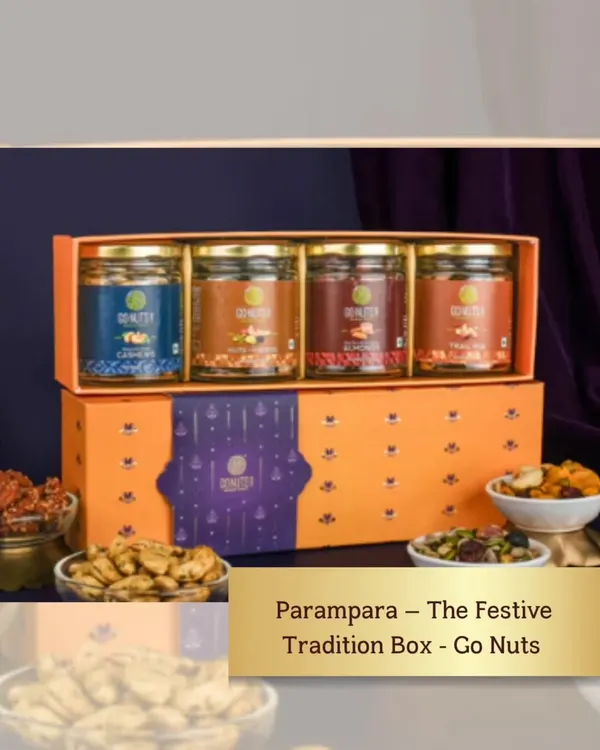 The 'Parampara' Festive Tradition Box is a perfect wedding gift that honors tradition. It contains four jars of premium assorted nuts and dried fruits in a beautiful orange and purple box.