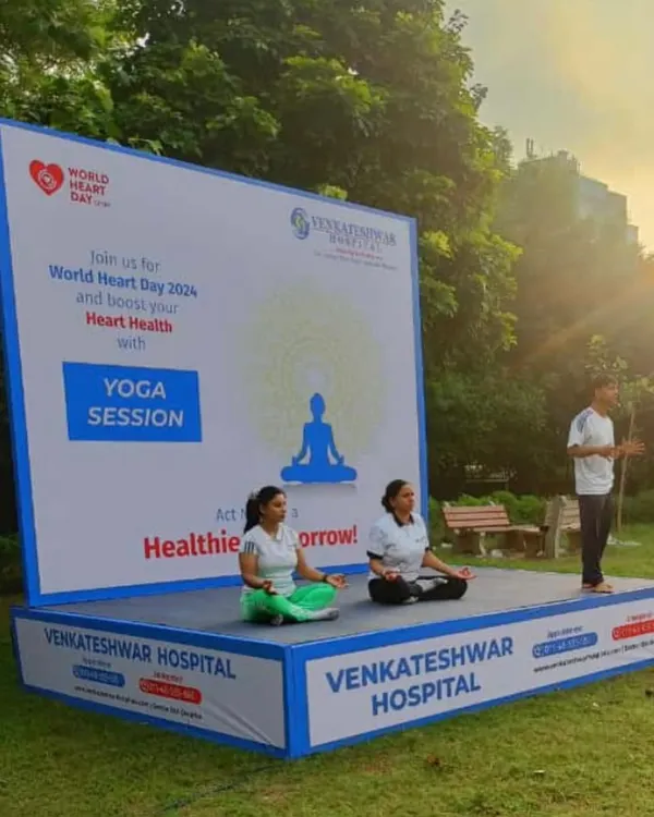 On stage leading a yoga session for World Heart Day, in an event organized with Venkateshwar Hospital. It was an honor to guide the community through poses to boost heart health.