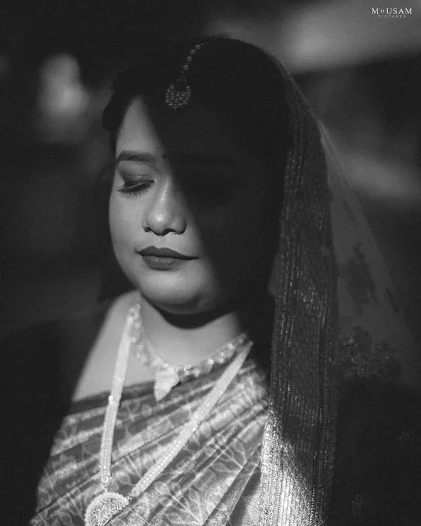 A dramatic black and white portrait of our beautiful Odia bride, captured during her wedding to her Telugu groom. The play of shadow and light highlights her features and the quiet emotion of the day.