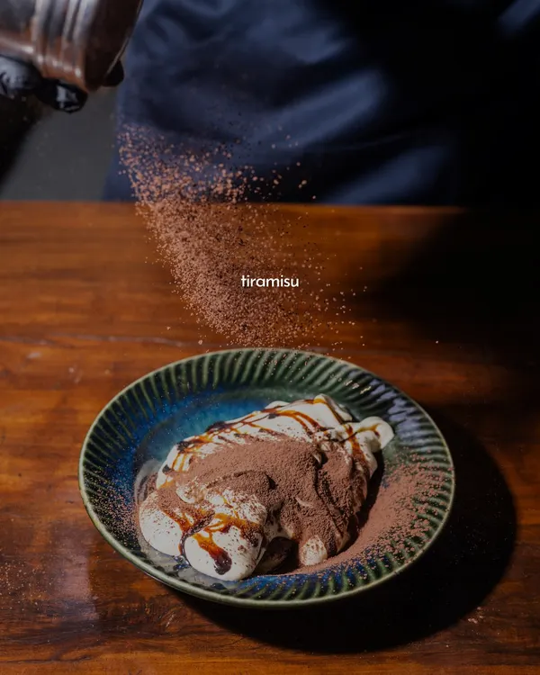 A little dusting of cocoa is the final touch on my classic Tiramisu. This is my take on Italy's most beloved dessert, with layers of coffee-soaked ladyfingers and rich mascarpone cream. It's a sweet, airy, and indulgent way to end your meal.