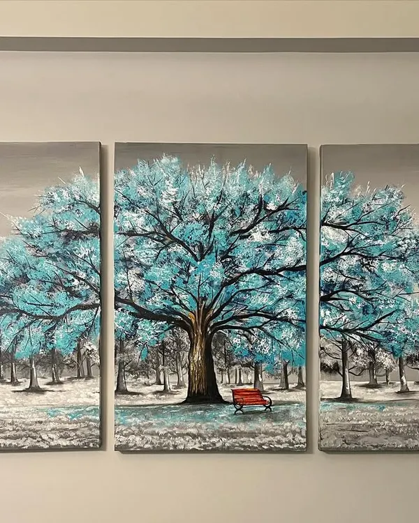 This is a three-panel canvas painting, or triptych, featuring a beautiful blue tree. It's designed to create a calm and peaceful focal point in a living room.
