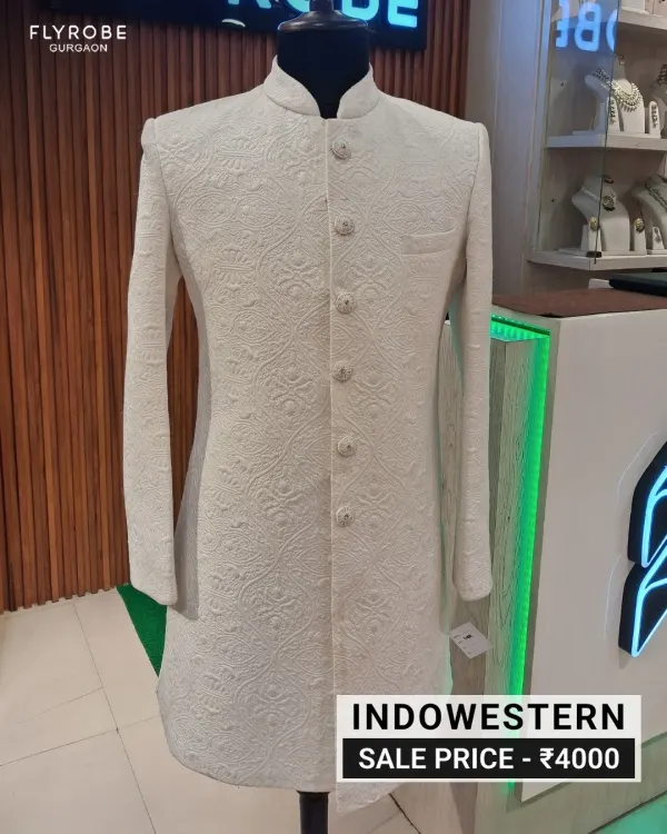 Elegance that never fades. This pre-loved white sherwani features intricate self-embroidery, offering a timeless and sophisticated look for any groom or wedding guest. You can make this exquisite Indo-western piece yours for just ₹4000.