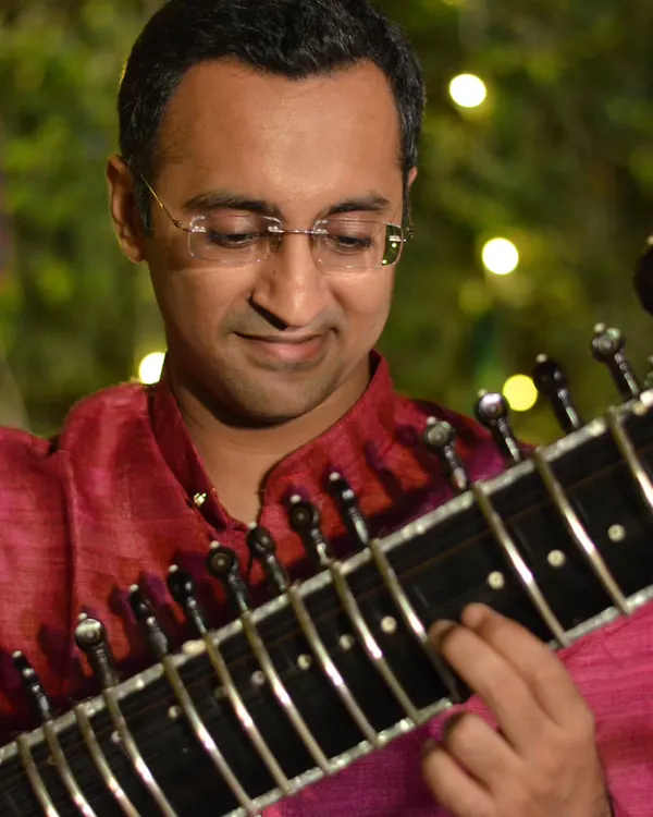 A close-up from an evening concert, with beautiful bokeh lighting in the background.
