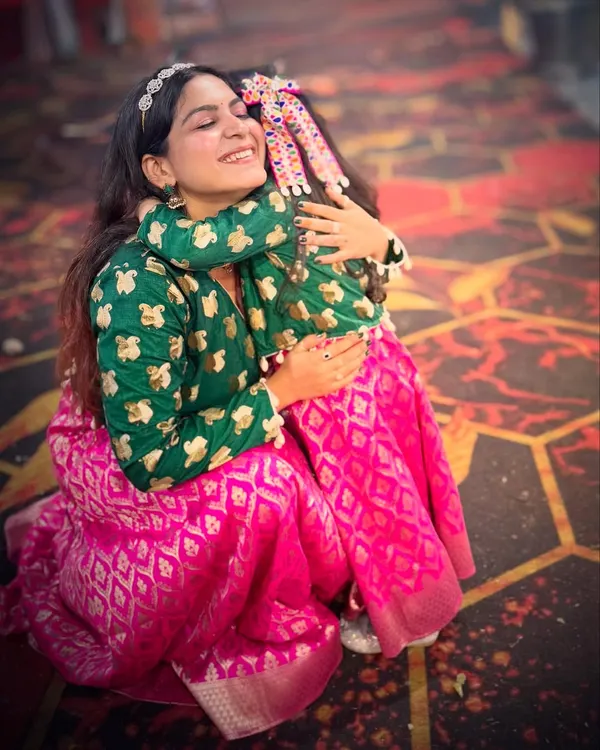 A heartwarming moment with my daughter, both of us wearing the matching ethnic outfits I designed from an old silk saree. This project was all about recycling with love.