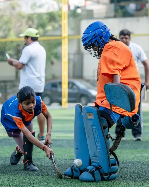 The moment of truth. A young striker faces off against our goalie during a practice match. We create these high-pressure scenarios to build skill, confidence, and a love for the game.