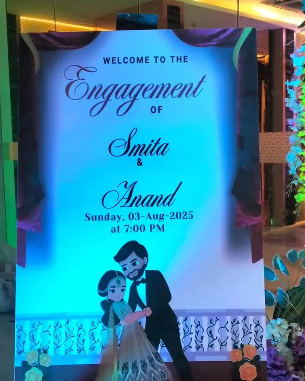 A personalized welcome sign is a great way to greet your guests. This one was designed for an engagement ceremony, featuring the couple's names, date, and a cute caricature.