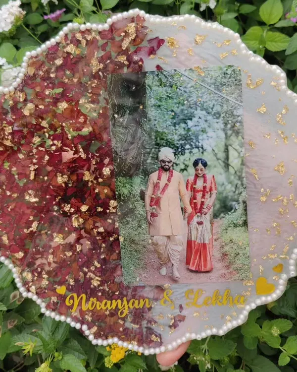 This is one of my favorite commissions. I preserved a couple's wedding varmala and photo in this beautiful resin plaque, creating a lasting memory of their special day.
