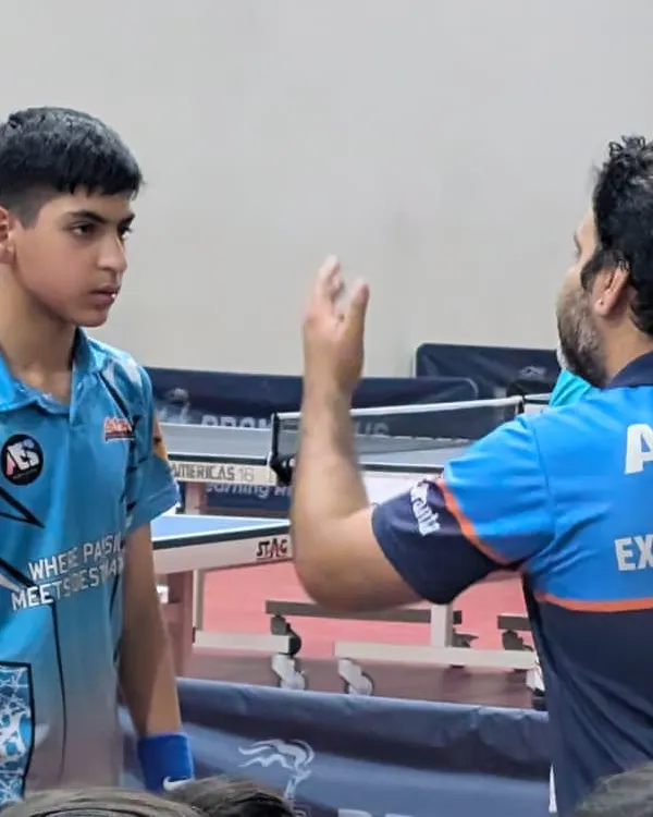 Giving tactical advice to a player during a timeout. A coach's guidance at the right moment can change the game.
