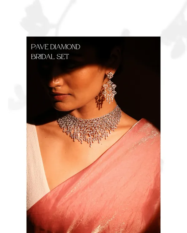 This Pave Diamond Bridal Set is the epitome of unforgettable sparkle. The necklace and matching earrings feature over 30 carats of round brilliant diamonds, meticulously set to create a cascade of light.