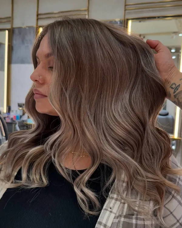 This creamy vanilla blonde balayage is soft, seamless, and stunning. I blended icy blonde with creamy, warm tones to create a natural, sun-kissed effect that feels both luxurious and modern.