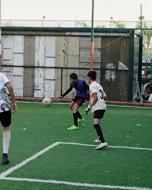 Here is a glimpse of our players in the middle of a competitive match during the Peace Soccer Cup. This image captures the intensity and focus we instill in our athletes as they challenge an opponent for ball possession on the turf.