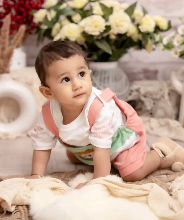 Exploring the world one crawl at a time. We capture important physical milestones like crawling, preserving the memory of their first moves towards independence in a beautiful studio setting.