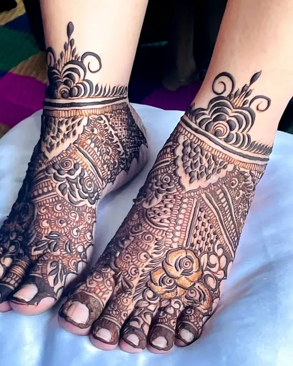 An elegant bridal feet design featuring a mix of floral and paisley patterns. The ankle cuff is adorned with a modern, swirling motif.