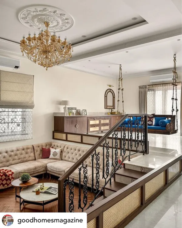 This sunken living room, inspired by old Kolkata homes, is one of my favorite designs. By lowering the floor, I created a grander sense of space with a partial double height, making it an inviting area for family gatherings. The design blends classic colonial charm with modern needs, featuring ornate wrought iron, a grand chandelier, and comfortable, elegant seating.