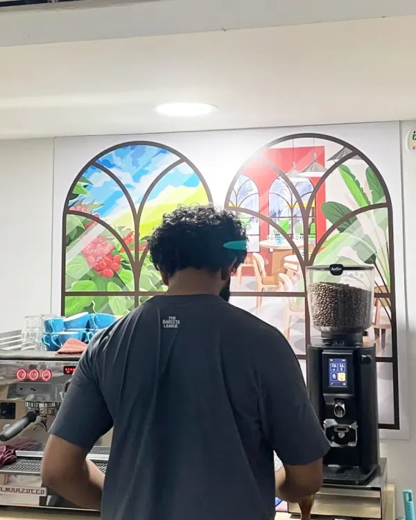 A student working on a professional La Marzocco espresso machine during our workshop with international barista Adwaith Menon.