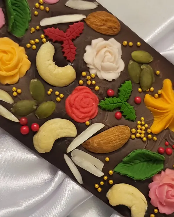 This is what I mean by chocolate that is made *dil se*! My designer dark chocolate bar is loaded with whole nuts, seeds, and beautiful, handcrafted chocolate flowers. It’s a feast for the eyes and so delicious.