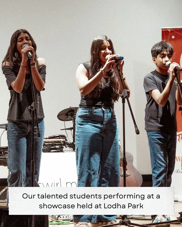 Three of our talented vocal students performing together at a showcase we held at Lodha Park. We encourage collaboration and give students the chance to experience singing in a group.