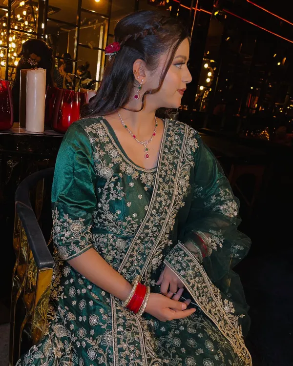 A beautiful party makeup look featuring an elegant emerald green sharara set. The makeup is soft and neutral, with nude tones on the eyes and lips to let the outfit shine.