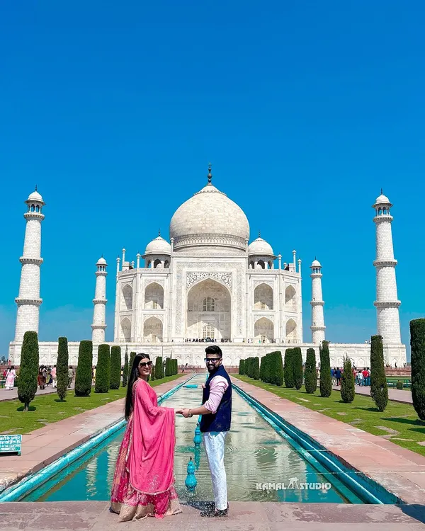 A timeless portrait at the symbol of eternal love, the Taj Mahal. This classic shot captures the grandeur of your story against an iconic backdrop, perfect for couples who want their love to be monumental.