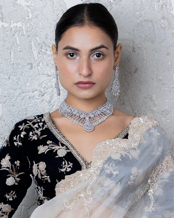 Make a statement with luxury and elegance. This American diamond choker from our new collection showcases a brilliant sparkle and graceful detailing.