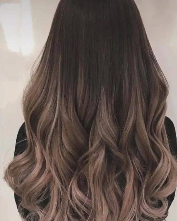 A beautiful example of a soft balayage with gentle waves. This technique creates a natural, blended look that grows out beautifully.