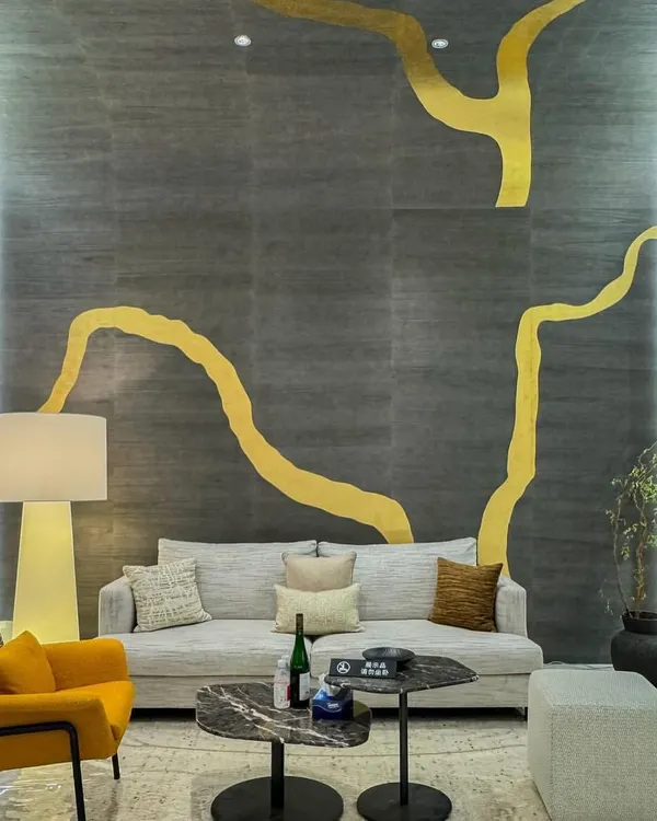 This award-winning metallic leaf wallcovering is a true showstopper. Inspired by the ancient Japanese art of Kintsugi, the grand-scale golden design flows across a dark, textured background, creating a powerful statement of strength and beauty.