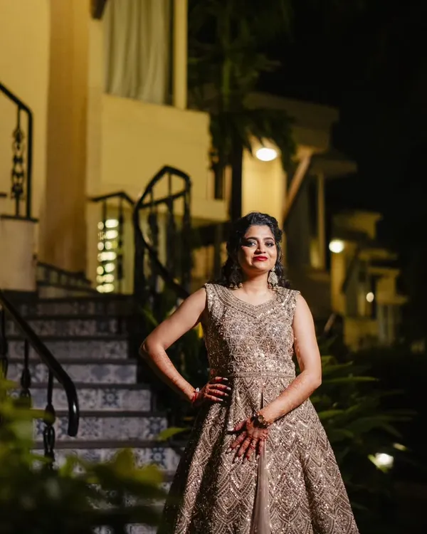 Smokey eyes and a bold red lip are a classic, can't-go-wrong combination for a sangeet night. This bride looks absolutely stunning and ready to dance.