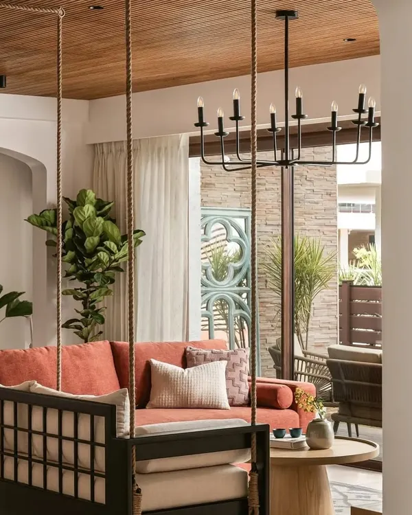 Our custom-made swing, console, and center table featured in a beautiful Bengaluru residence by Weespaces, as seen in Elle Decor. This living space captures a relaxed, Californian-inspired aesthetic with an earthy Indian sensibility, perfectly showcasing how our furniture adapts to a client's unique vision.